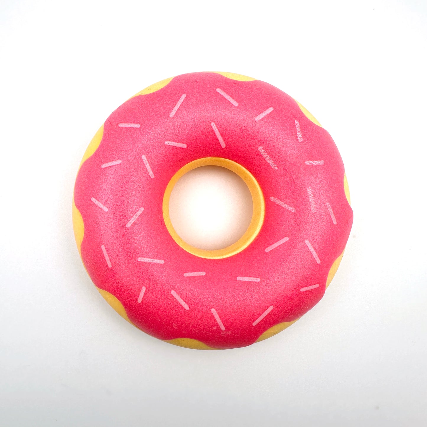 Rubber donut dog toy with functions of grinding teeth, cleaning teeth, interactive companionship, relaxation, and vocalization