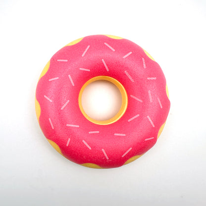 Rubber donut dog toy with functions of grinding teeth, cleaning teeth, interactive companionship, relaxation, and vocalization