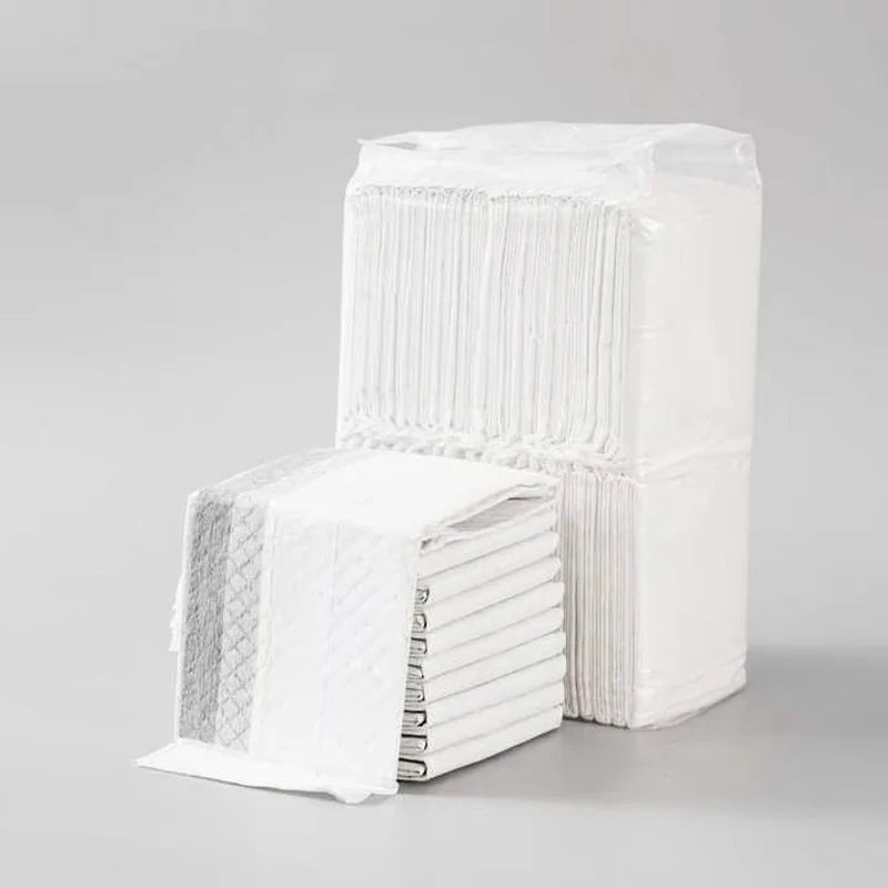 the ABSORBENT DOG PADS - 100/50/40/20PCS Absorbent Dogs Diapers, Disposable Puppy Training Pee Pads, Quick Dry Bamboo Charcoal Surface Mat, Clean Cushion