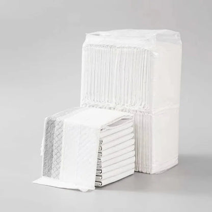 the ABSORBENT DOG PADS - 100/50/40/20PCS Absorbent Dogs Diapers, Disposable Puppy Training Pee Pads, Quick Dry Bamboo Charcoal Surface Mat, Clean Cushion